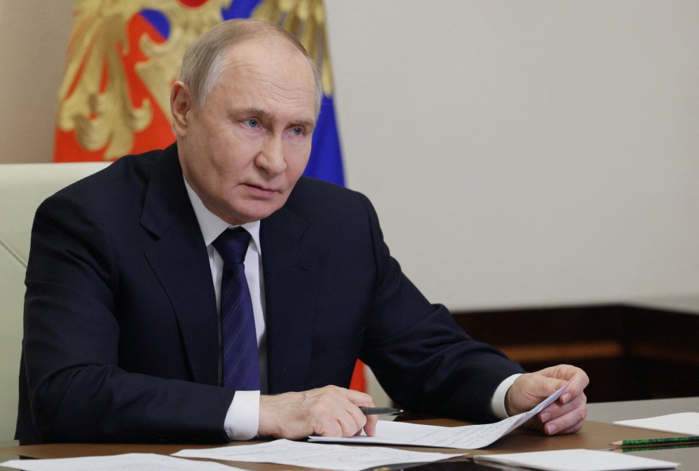 In this pool photograph distributed by the Russian state agency Sputnik, Russia's President Vladimir Putin chairs a meeting on educational and museum complexes via a videoconference at the Novo-Ogaryovo state residence outside Moscow on June 25, 2025. — AFP pic