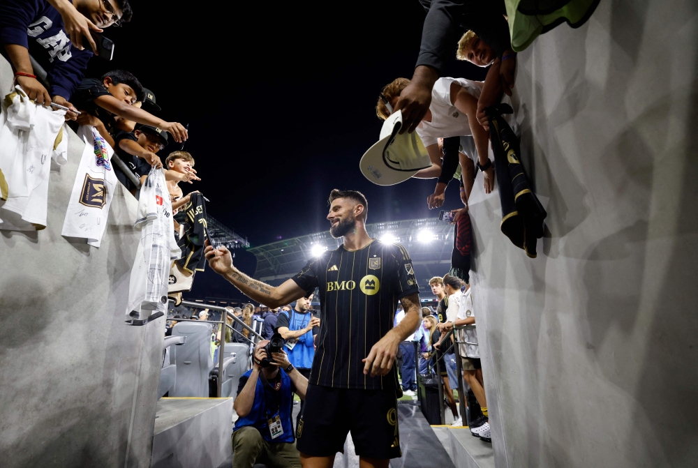 Olivier Giroud of Los Angeles FC poses for photos with fans after his last MLS soccer game against Vancouver Whitecaps at BMO Stadium on June 29, 2025 in Los Angeles, California. — AFP pic
