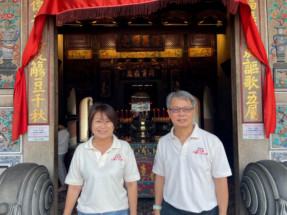 Temple committee president Foo Yen Chow and vice president Datuk Lio Chee Yeong at the entrance of the temple.