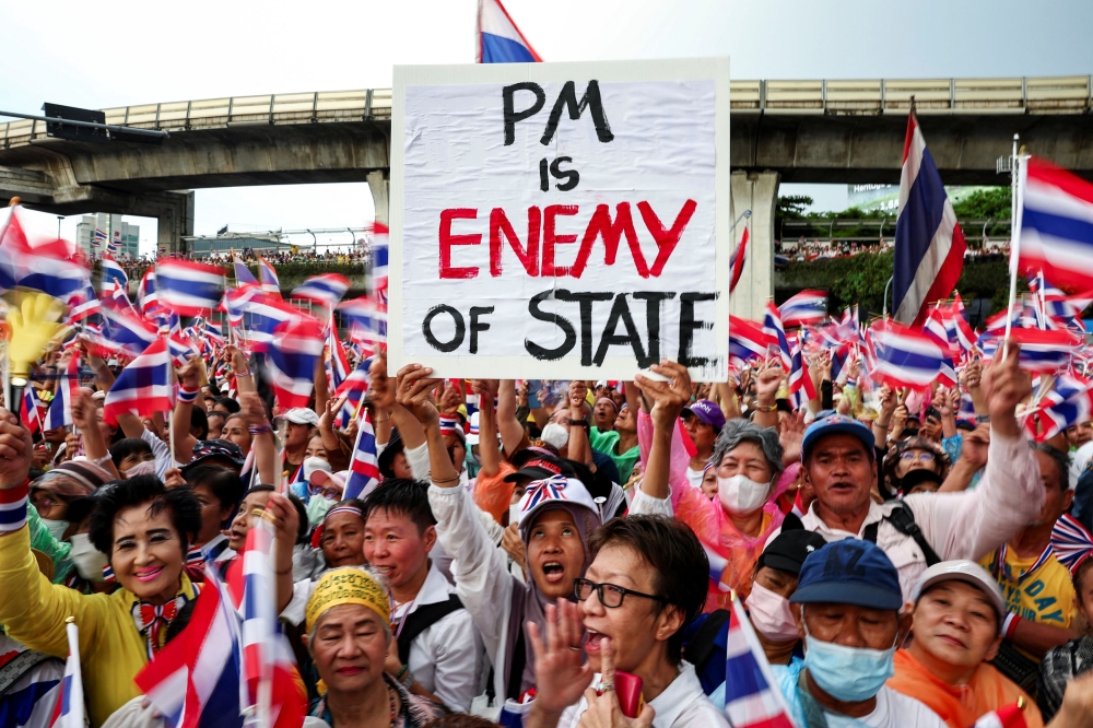 A person holds a placard as anti-government protesters gather at the Victory Monument during a protest calling for Thailand’s Prime Minister Paetongtarn Shinawatra to resign after her leaked phone call with former Cambodian Prime Minister Hun Sen on the Thailand-Cambodia border dispute, in Bangkok, Thailand, June 28, 2025. — Reuters pic 