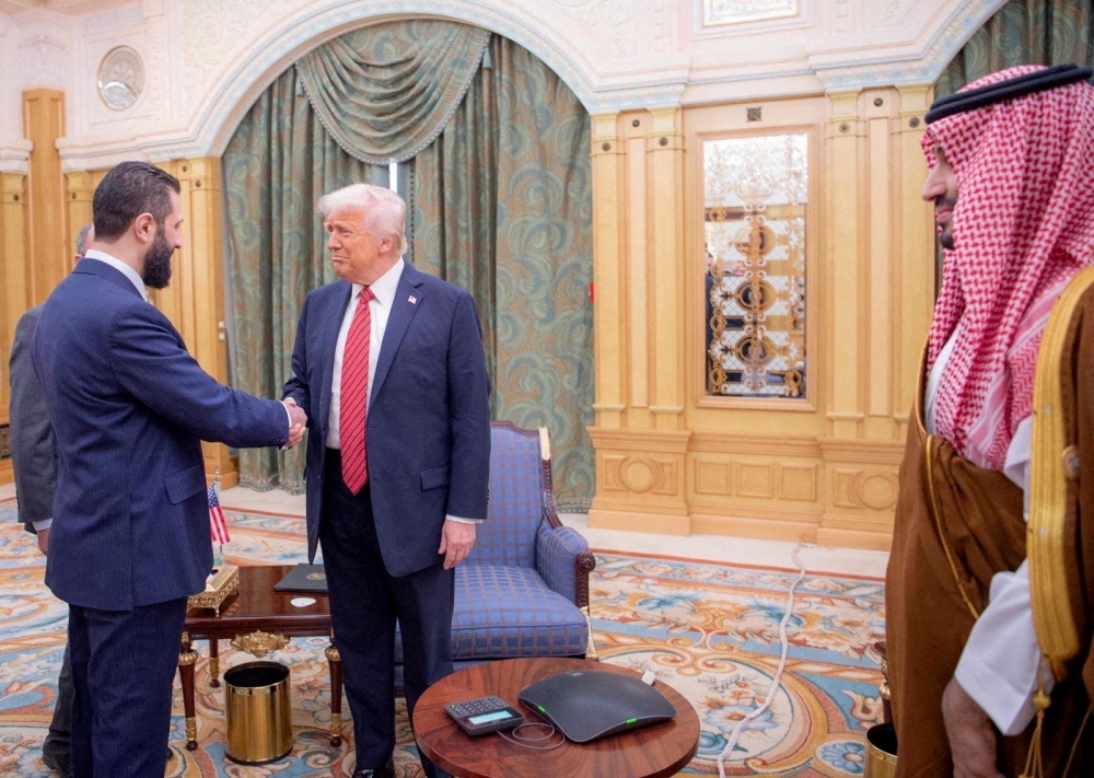 File picture of US President Donald Trump meeting with Syrian President Ahmed al-Sharaa in Riyadh, Saudi Arabia, in this handout released on May 14, 2025. — Saudi Press Agency handout pic via Reuters