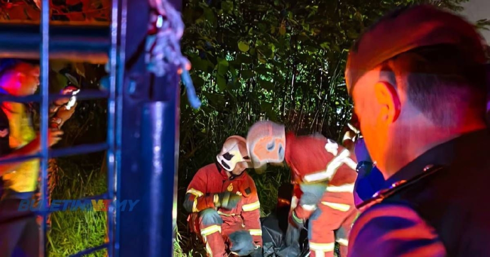 Firefighters attend the scene of a blaze that destroyed a two-storey house in Kampung Mansiang, Kota Kinabalu, June 30, 2025. A 72-year-old woman was found dead at the scene. — Picture via Facebook/Bomba Channel