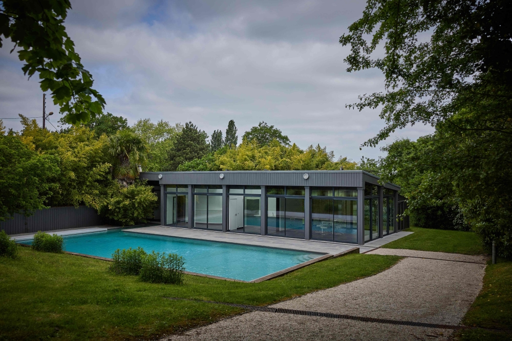 This photograph shows the swimming pool and poolhouse at a former residence of the late German fashion designer Karl Lagerfeld, in Louveciennes, near Paris, on May 15, 2025. — AFP pic