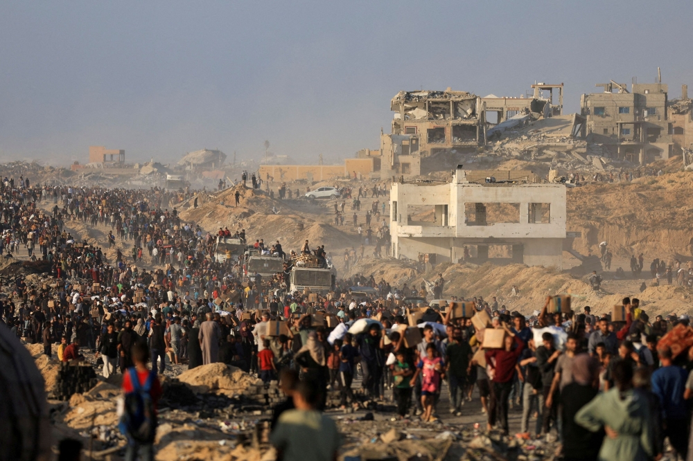 Palestinians gather to receive aid supplies in Beit Lahia, in the northern Gaza Strip, June 16, 2025. — Reuters pic