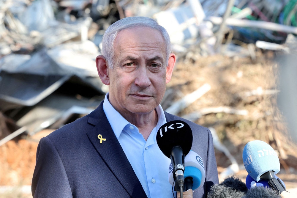 Israeli Prime Minister Benjamin Netanyahu delivers a statement during a visit to the Weizmann Institute of Science in Rehovot, which was struck by an Iranian missile barrage, June 20, 2025. — Reuters pic