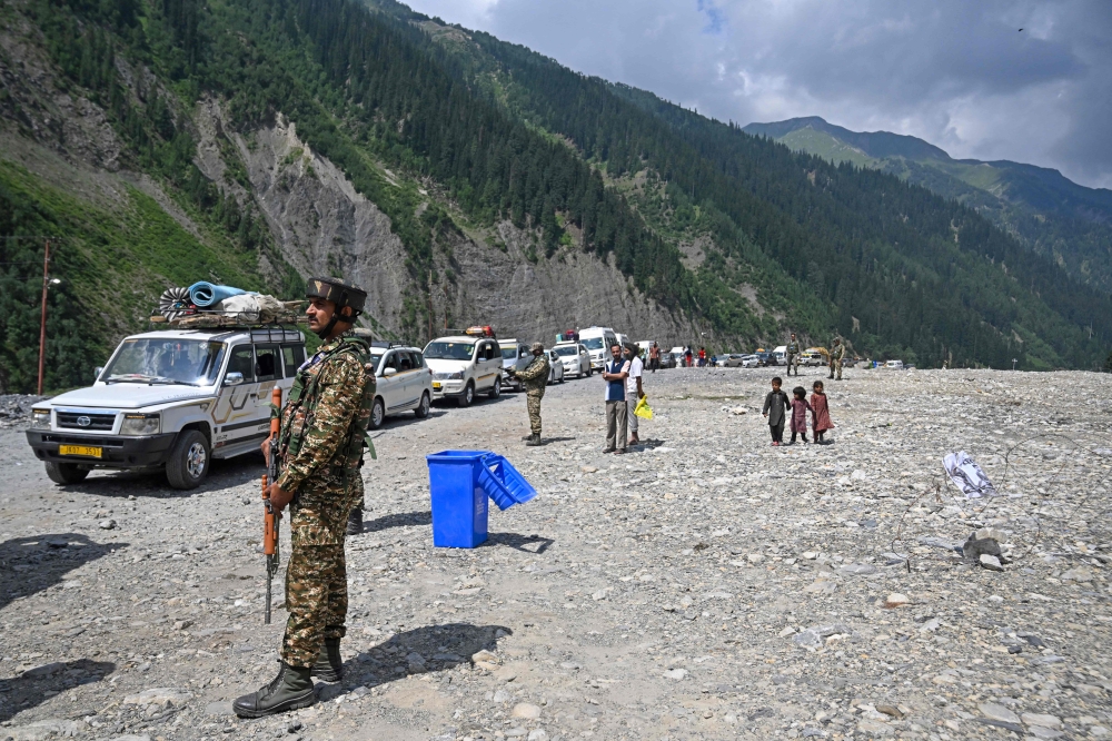 Indian security personnel patrol near a base camp in Baltal on July 2, 2025, ahead of Amarnath Yatra, the annual Hindu pilgrimage. — AFP pic