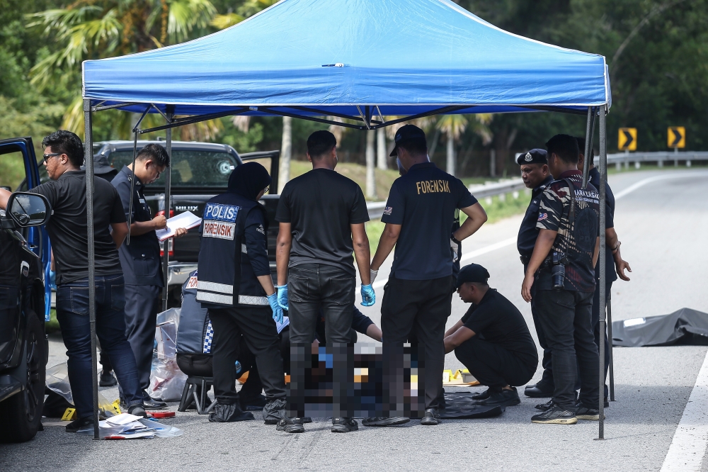 Two men suspected of being criminals were killed in a shootout with police at the North-South Expressway (PLUS) entrance ramp here at 8.05am. — Bernama pic