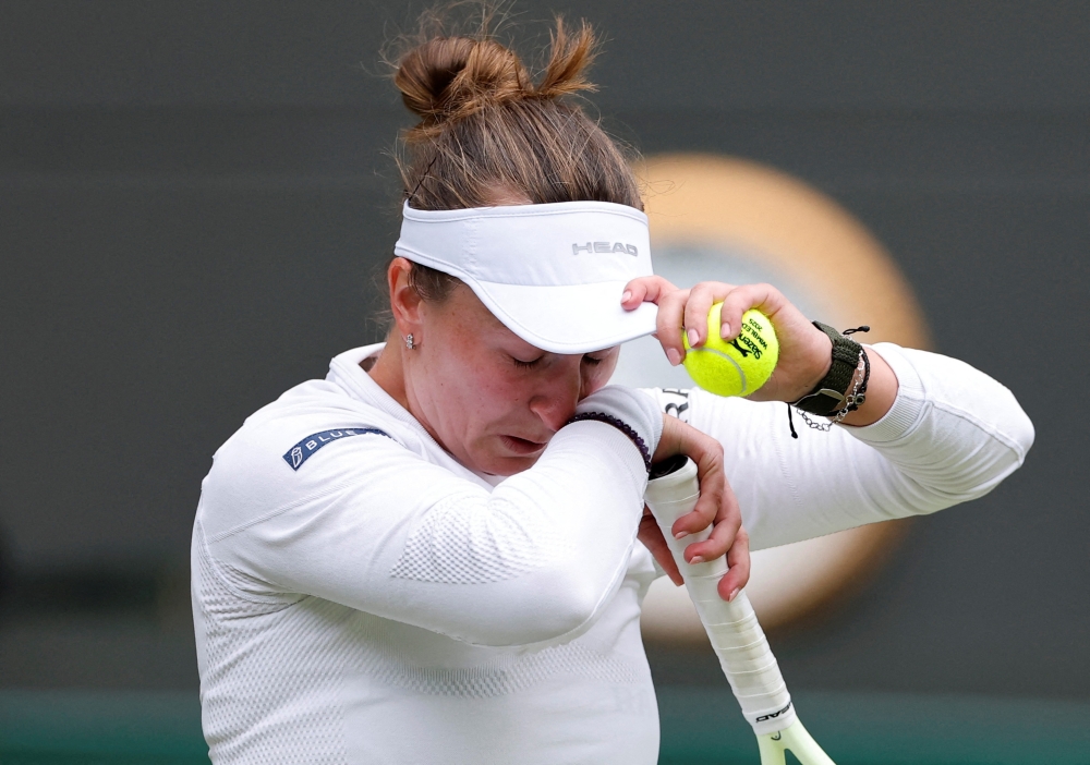 Barbora Krejcikova reacts during her third-round match against Emma Navarro at Wimbledon in London July 5, 2025. — Reuters pic