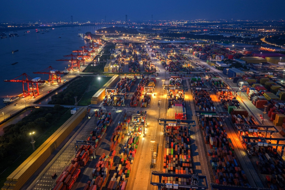 An aerial view of shipping containers stacked at a port in Nanjing, in eastern China's Jiangsu province, July 6, 2025. — AFP pic 