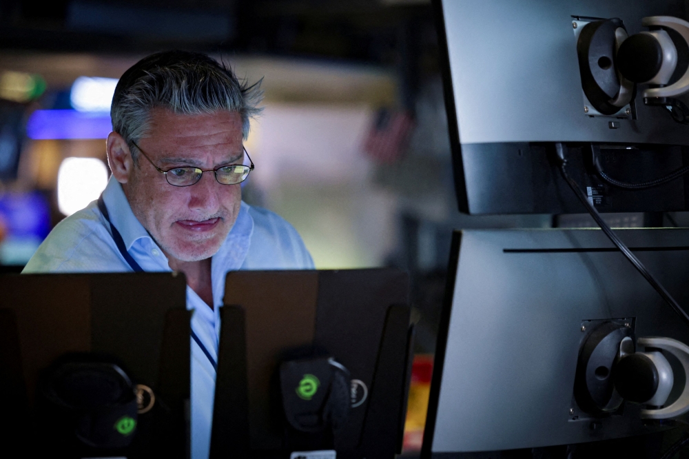 A trader works on the floor at the New York Stock Exchange (NYSE) in New York July 7, 2025. — Reuters pic