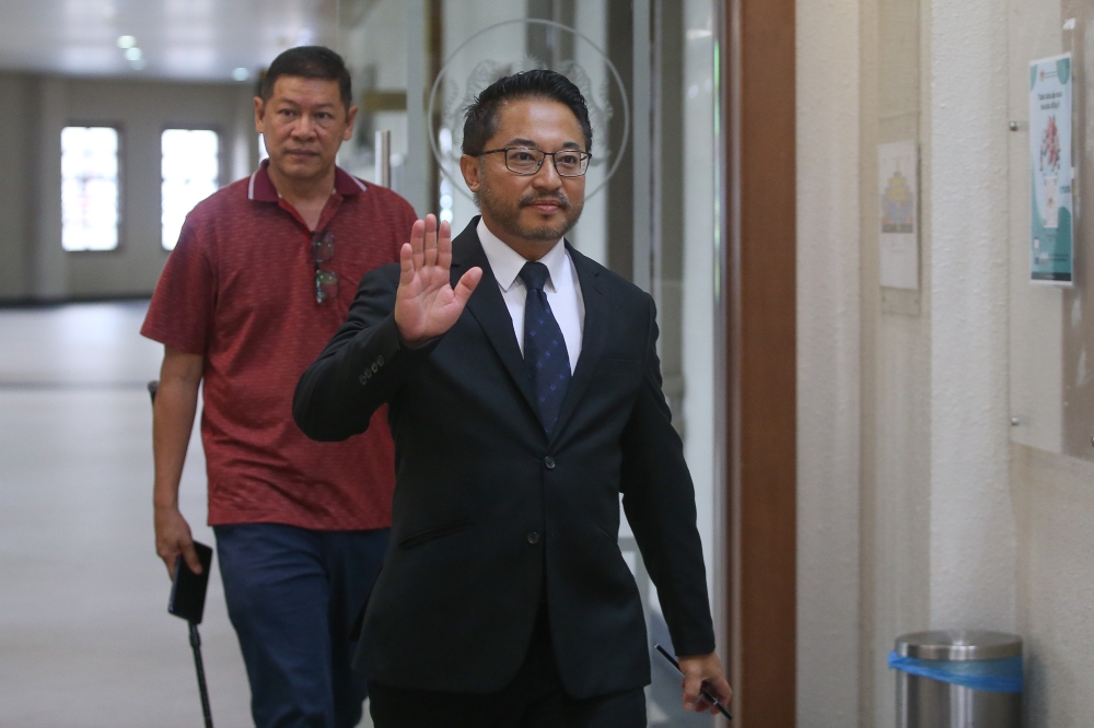 Former Umno information chief Isham Jalil is pictured at the Kuala Lumpur High Court Complex on July 8, 2025. — Picture by Yusof Mat Isa