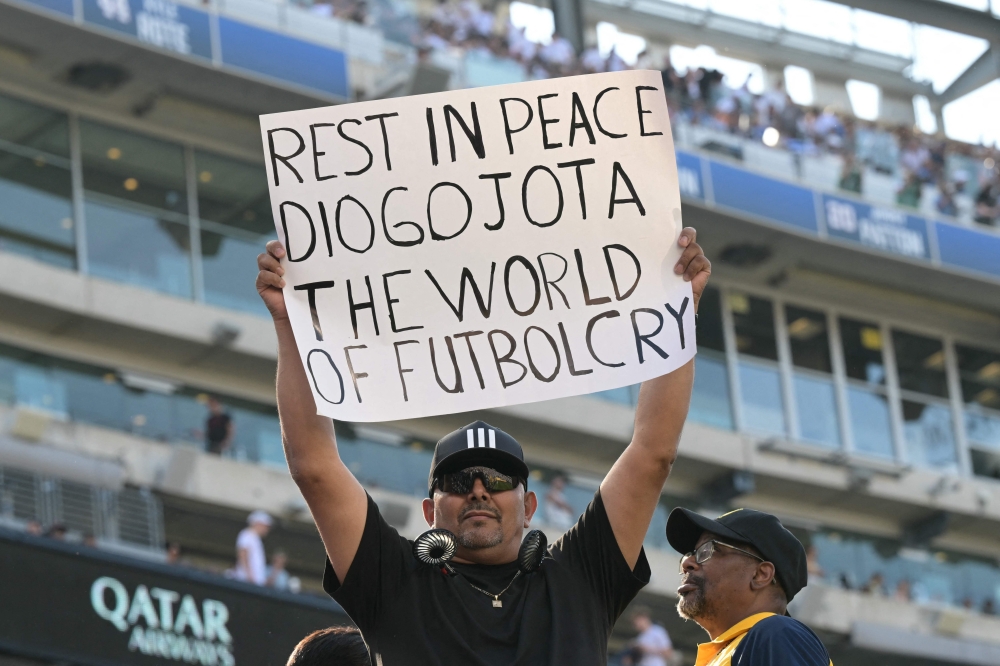 A fan shows a sign in tribute to Liverpool's Portuguese forward Diogo Jota, who passed away after a car crash, during the Fifa Club World Cup 2025 quarterfinal football match between Spain's Real Madrid and Germany's Borussia Dortmund at the MetLife stadium in East Rutherford, New Jersey July 5, 2025.  — AFP pic 