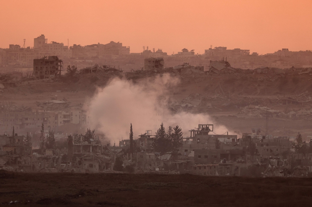 This picture, taken from a position at Israel's border with the Gaza Strip, shows smoke billowing during an Israeli strike on the besieged Palestinian territory. — AFP pic
