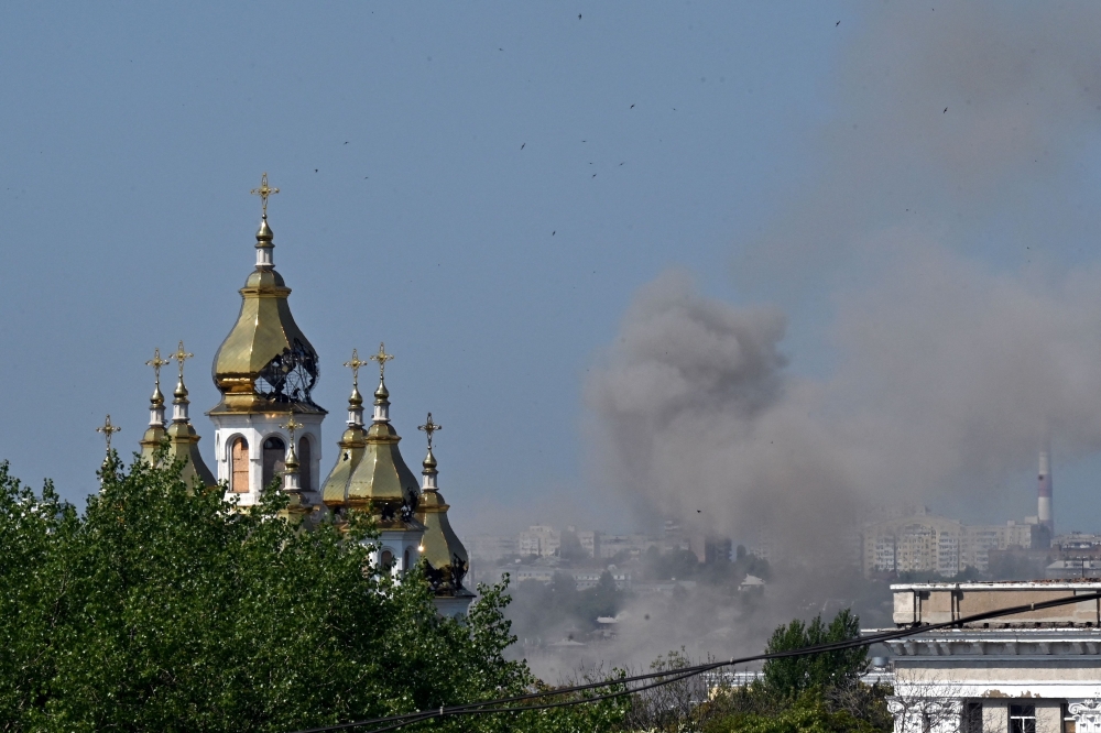 Smoke clouds rise near the Holy Myrrh-Bearing Women Church after a drone attack in Kharkiv amid the Russian invasion of Ukraine July 7, 2025. — AFP pic