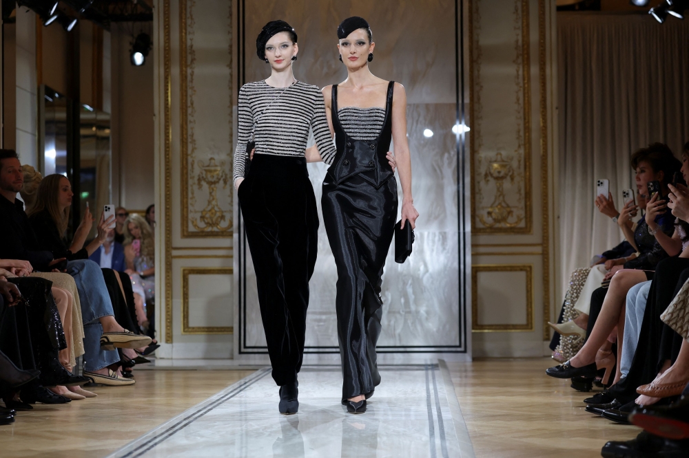 Models present creations by designer Giorgio Armani as part of his Haute Couture Fall/Winter 2025-2026 collection show for fashion house Giorgio Armani Prive, in Paris July 8, 2025. — Reuters pic  