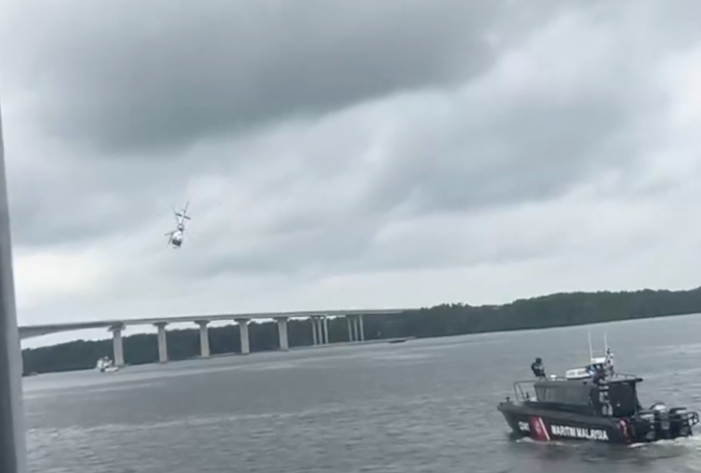A police helicopter carrying five crew members made an emergency landing and crashed near Sungai Pulai in Gelang Patah earlier today. — Screengrab from X/Bernama 