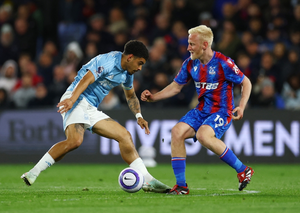 Nottingham Forest's Morgan Gibbs-White in action with Crystal Palace's Will Hughes at Selhurst Park, London May 5, 2025. Tottenham are set to sign Gibbs-White by triggering the England international’s £60 million (RM348 million) release clause, according to reports yesterday. — Reuters pic