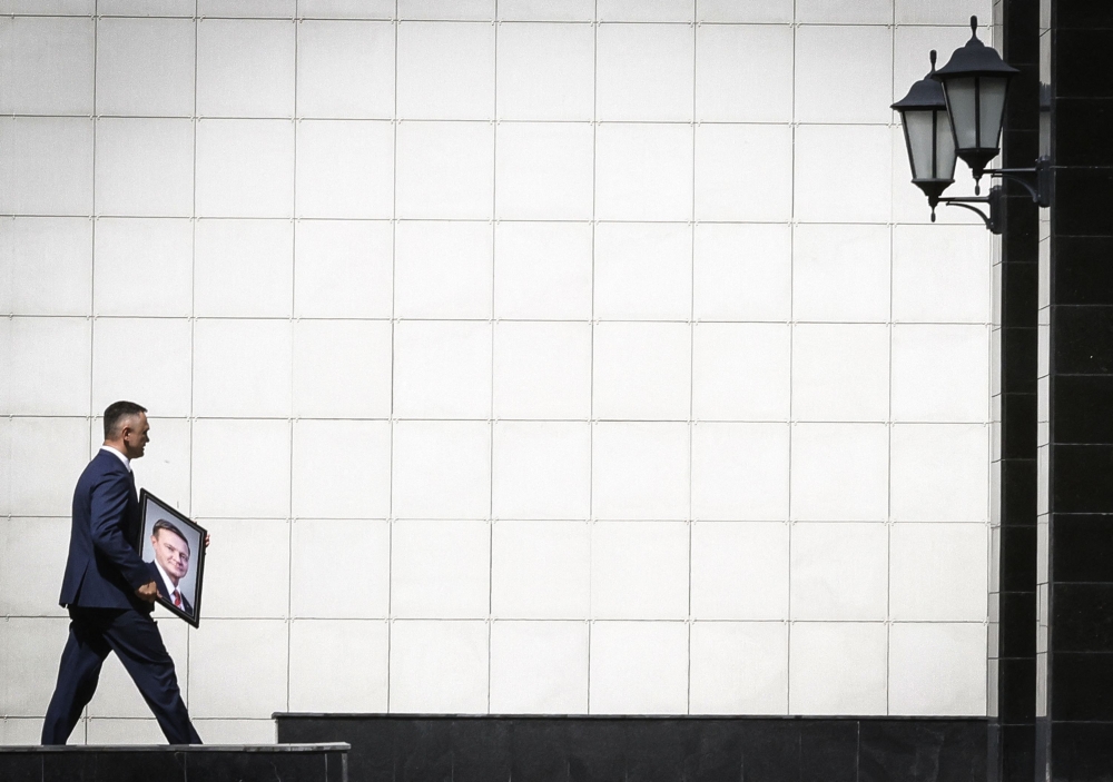 An employee carries a portrait of former transport minister Roman Starovoyt, who died recently, during a farewell ceremony in Moscow July 10, 2025. Starovoyt, 53, had been Russia's transport minister for a year and was previously the governor of the border Kursk region, where Russia had battled a Ukrainian incursion. — AFP pic