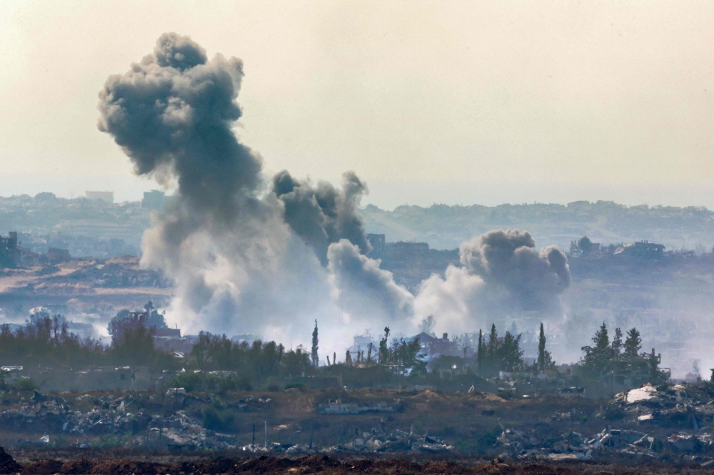 This picture taken from a position at Israel's border with the Gaza Strip shows smoke billowing during an Israeli strike on the besieged Palestinian territory July 10, 2025. — AFP pic