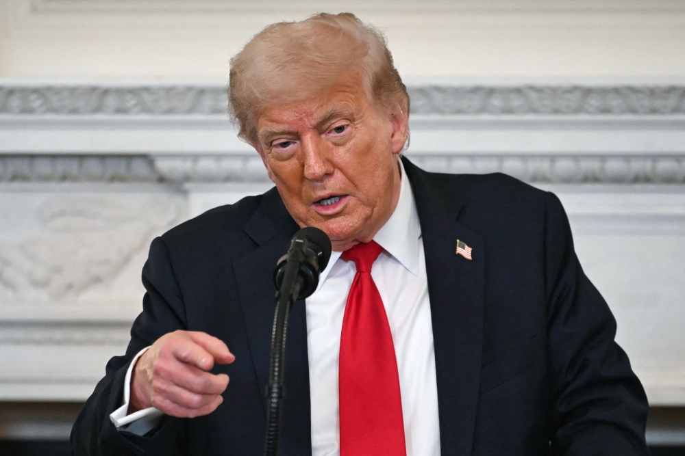 US President Donald Trump speaks during a White House Faith Office luncheon in the State Dining Room at the White House in Washington July 14, 2025. — AFP pic