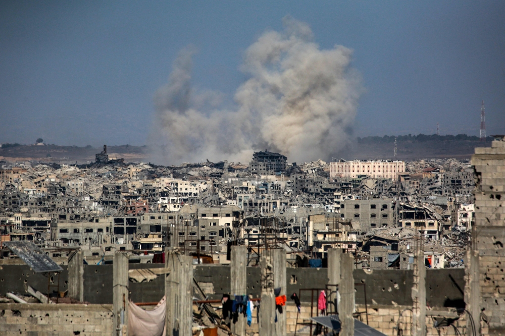 This picture taken from western Jabalia in the central Gaza Strip shows smoke billowing east of Gaza City, in the central Gaza Strip following Israeli strikes on July 13, 2025. — AFP pic