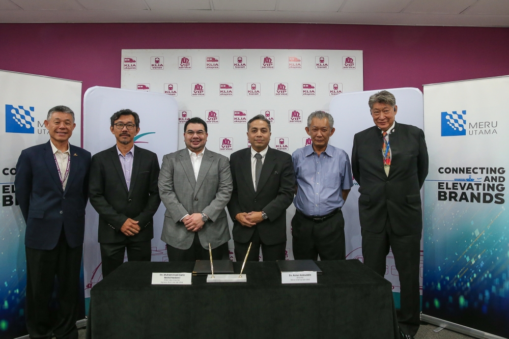(From left) ERL acting chief executive officer Yeow Wei-Wen, Meru Utama general manager Herman Lim, ERL alternate director Muhammad Hariz Mohd Nadzmi, Meru Utama director Aznur Azizuddin, Ancom Nylex Berhad executive director Datuk Hasnul Hassan, and executive chairman Datuk Siew Ka Wei pose for a group picture after the concession signing ceremony at ERL Office, KL Sentral station on July 15, 2025. — Picture by Yusof Mat Isa