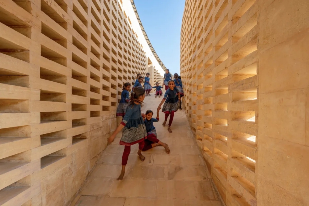 Girls play in a shaded passage at the Rajkumari Ratnavati Girls School in Rajasthan, northwest India, designed by New York architect Diana Kellogg. Photo taken 2021 by Vinay Panjwani. — Thomson Reuters Foundation pic/Diana Kellogg Architects Handout