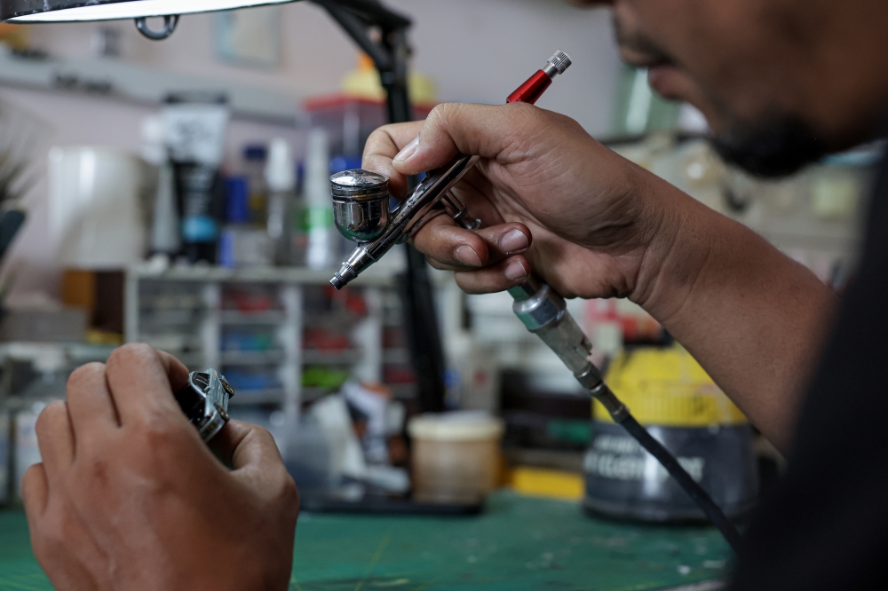 Starting seriously in 2020, Mohd Jaidin Mustafa uses Hot Wheels brand miniature cars as a base before switching to miniature cars made from resin, a special kind of plastic that is produced through 3D printing. — Bernama pic