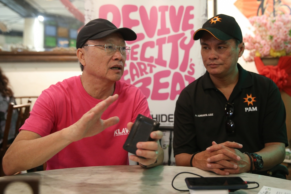C.I.S Network president Datuk Vincent Lim (left) and Malaysian Institute of Architect president Adrianta Aziz speak to Malay Mail at the inaugural Kuala Lumpur Architecture Week on July 20, 2025. — Picture by Yusof Mat Isa