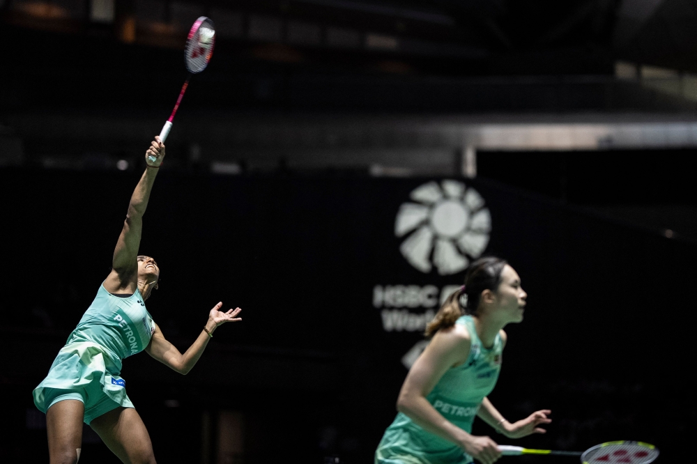 Pearly Tan and Thinaah Muralitharan play a point against China’s Liu Shengshu and Tan Ning during the women’s doubles final of the Japan Open at Tokyo Metropolitan Gymnasium in Tokyo on July 20, 2025. — AFP pic