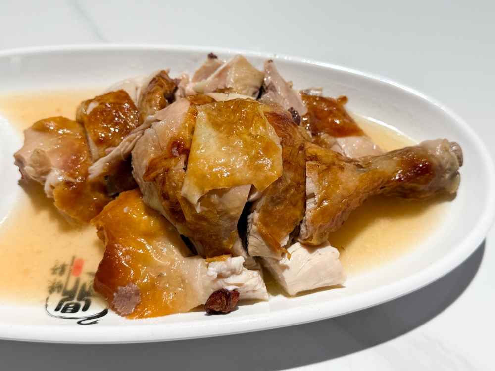 Charcoal Roast Chicken is finger licking good with its moist, plump flesh and golden skin. — Picture by Lee Khang Yi