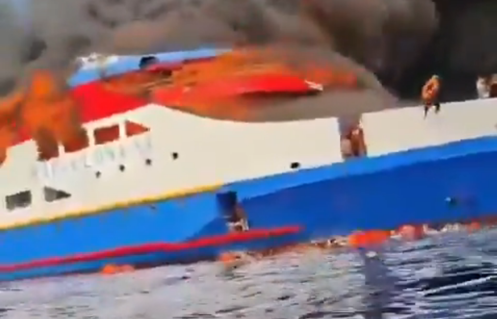 A screen shot from a video online shows people jumping off the burning ferry.