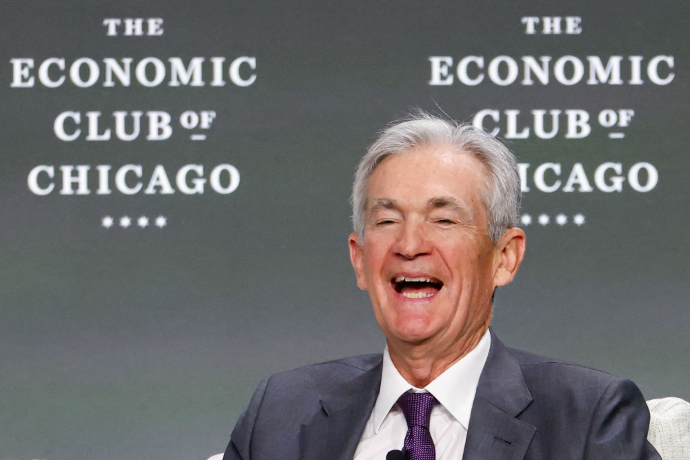 US Federal Reserve Chair Jerome Powell smiles as he speaks at the Economic Club of Chicago in Chicago, Illinois, on April 16, 2025. — AFP pic