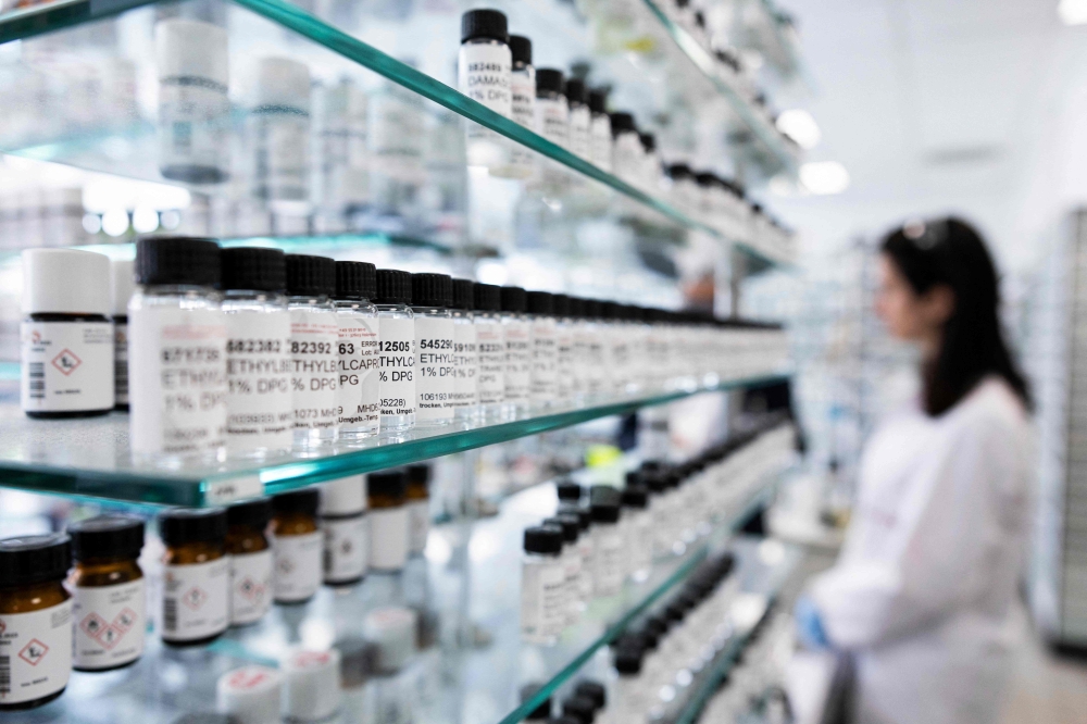 Vials containing dissolved raw materials used to develop perfume oil formulas are seen in a mixing room at the Symrise company in Holzminden, central Germany July 8, 2025. At Symrise’s headquarters in Holzminden, each day at the company’s in-house perfumery school begins the same way: sniffing out scents from dozens of tiny bottles while blindfolded. — AFP pic 