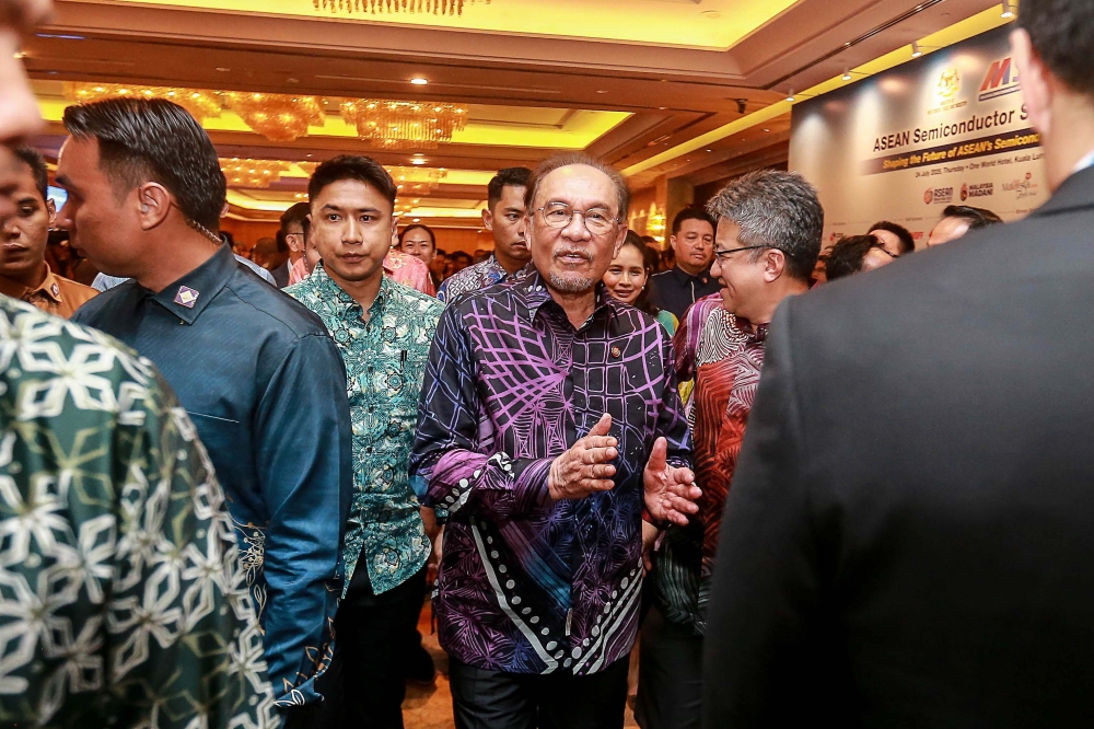 Prime Minister Datuk Seri Anwar Ibrahim visits exhibition booths during the closing ceremony of the Asean Semiconductor Summit in Petaling Jaya July 24, 2025. — Picture by Sayuti Zainudin