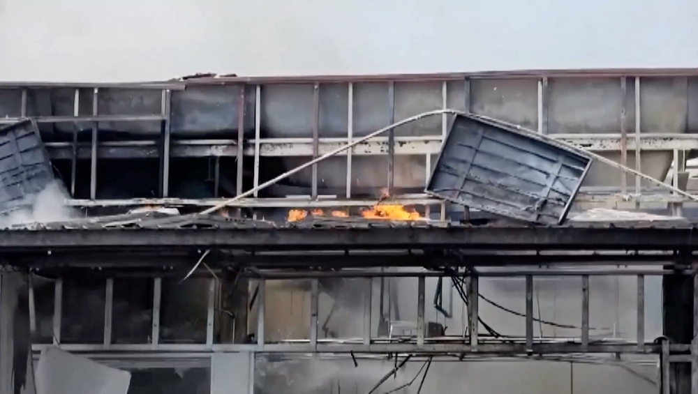 Smoke and fire rise from a convenience store at a gas station, amid the clashes between Thailand and Cambodia, in Kantharalak district, Sisaket province, Thailand, July 24, 2025, in this screengrab obtained from a handout video. — TPBS handout pic via Reuters
