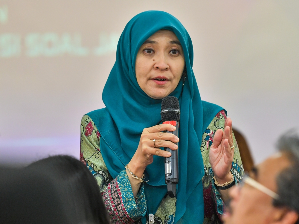 Suhakam Children’s Commissioner Farah Nini Dusuki speaks to the media after a briefing session with MPs and Senators at Parliament building, November 27, 2023. — Bernama pic 