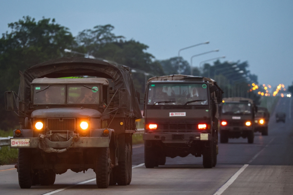 Army vehicles drive along a road in Buriram province, after Thailand scrambled an F-16 fighter jet to bomb targets in Cambodia following artillery volleys from both sides that killed civilians, Thailand, July 25, 2025. — Reuters pic