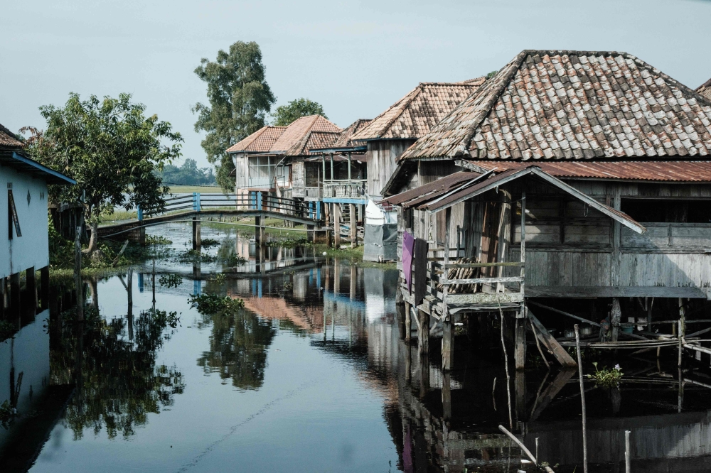 This photo taken on June 11, 2025 shows a general view of traditional raised stilt houses in Bangsal, South Sumatra. The Central Statistics Agency noted the significant gap between big cities and rural areas, with villages still seeing a higher poverty rate. — AFP pic