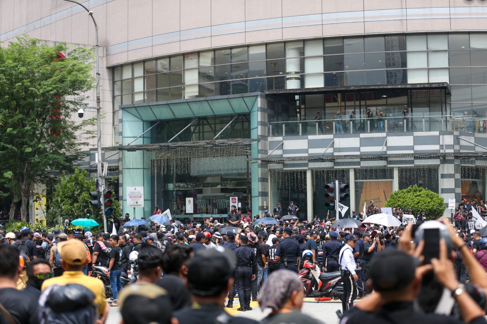 Protesters gather in front of Sogo during the ‘Turun Anwar’ rally as police close roads leading to Dataran Merdeka in Kuala Lumpur July 26, 2025 — Picture by Raymond Manuel