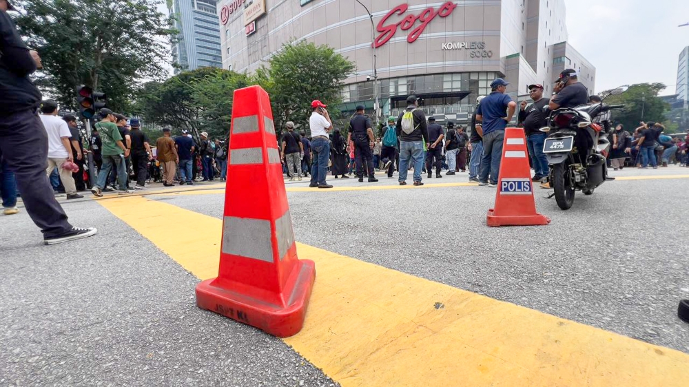 Protesters gather in front of Sogo during the ‘Turun Anwar’ rally as police close roads leading to Dataran Merdeka in Kuala Lumpur July 26, 2025. — Picture by Raymond Manuel
