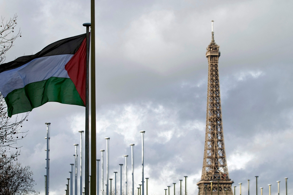 The Palestinian flag is raised for the first time (with the Eiffel tower in the background) on December 13, 2011 above a UN agency, the Unesco headquarters in Paris. France will recognise the State of Palestine at the United Nations General Assembly in New York this upcoming September, President Emmanuel Macron announced on his social networks on Thursday. — AFP pic 