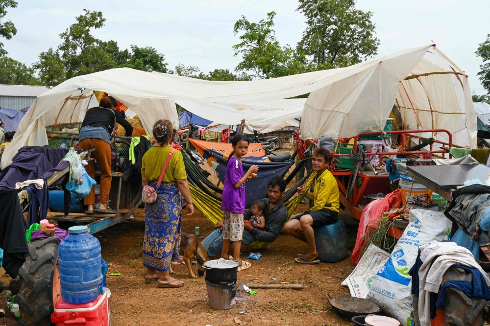 People who fled their homes near the border between Cambodia and Thailand, stay at a pagoda in Oddar Meanchey province in Cambodia July 26, 2025. — AFP pic 