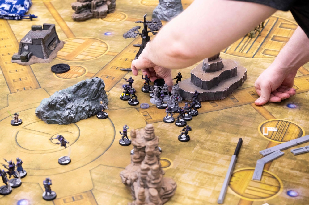 A player moves pieces of the game ‘Star Wars Legion’, which is mostly made in China, at Game Kastle in College Park, Maryland, July 24, 2025. — AFP pic