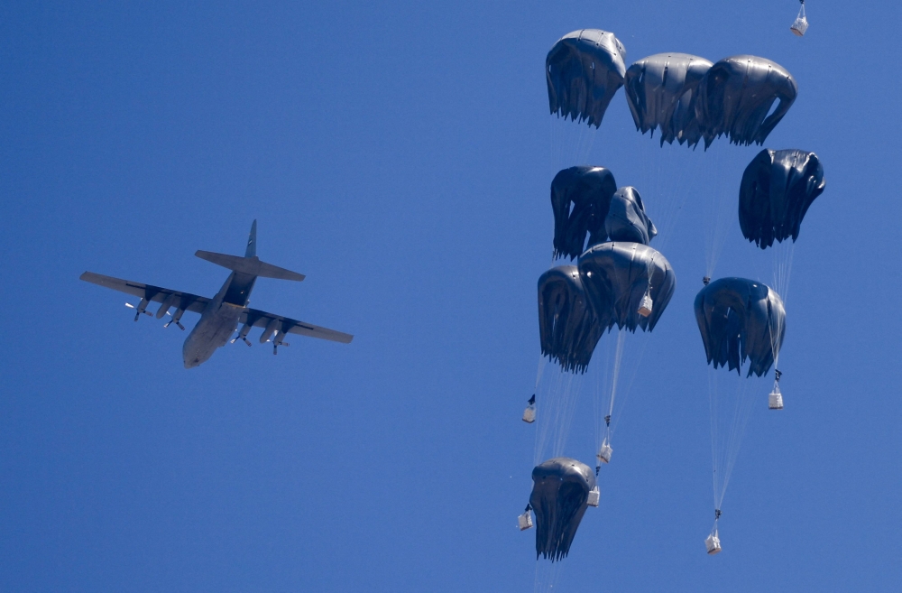 An airplane drops humanitarian aid over Gaza as seen from northern Gaza Strip July 27, 2025. — Reuters pic 