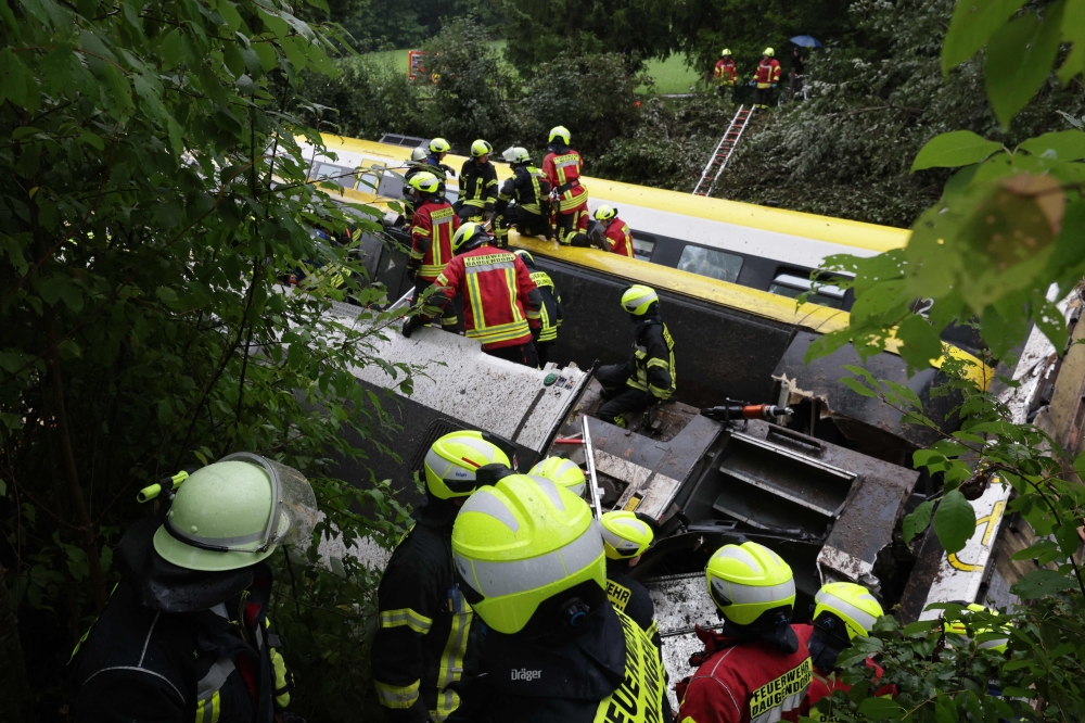 Rescue forces work at the site of a derailed train near Riedlingen near Biberach on July 27, 2025. — dpa handout pic via AFP