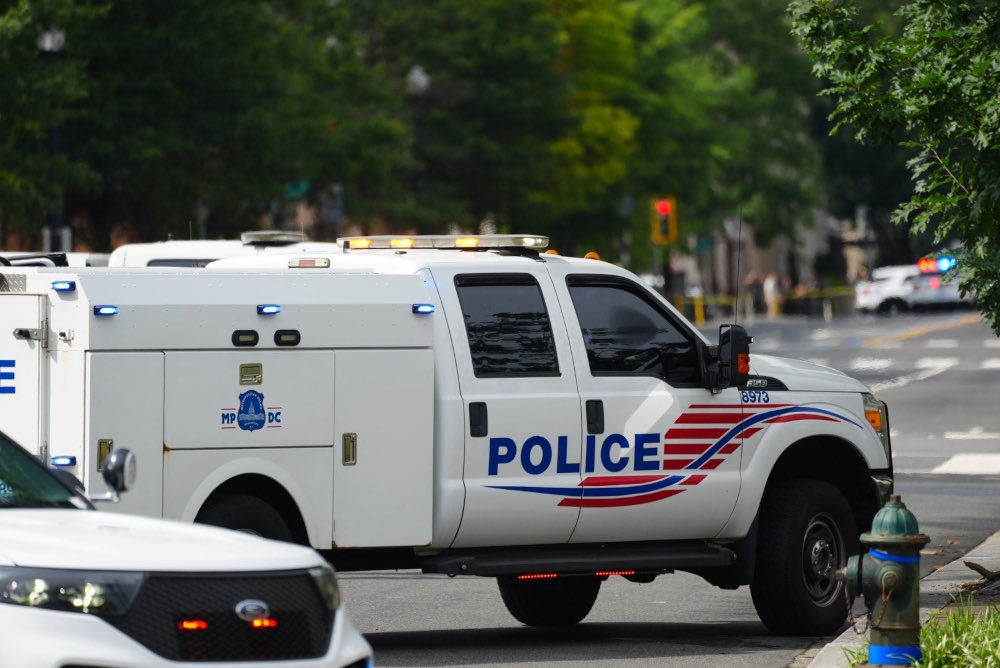 A police vehicle parked near the US Treasury building in Washington. The US Secret Service arrested a man after he climbed a gate at the US Treasury building in Washington on Sunday at about 2.30 pm, the agency said in statement. — Picture from X/Andrew Leyden