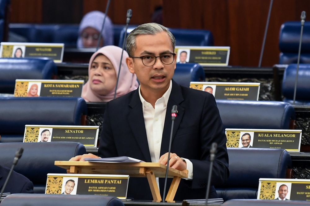 Communications Minister Datuk Fahmi Fadzil speaks at the Dewan Rakyat in Kuala Lumpur on July 29, 2025. — Bernama pic
