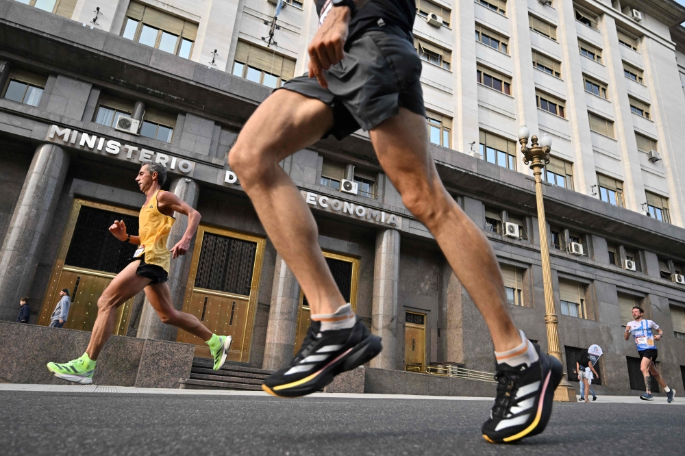 Runners compete during the Buenos Aires International Marathon in Buenos Aires on September 22, 2024. — AFP pic
