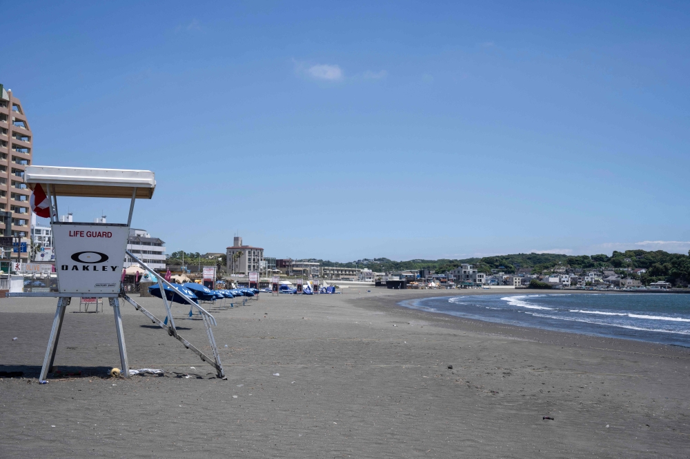 A beach is seen deserted due to a tsunami warning in Fujisawa city, Kanagawa prefecture on July 30, 2025. — AFP pic
